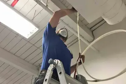 Pro Tech technician inspecting HVAC system during commercial duct cleaning St Louis MO
